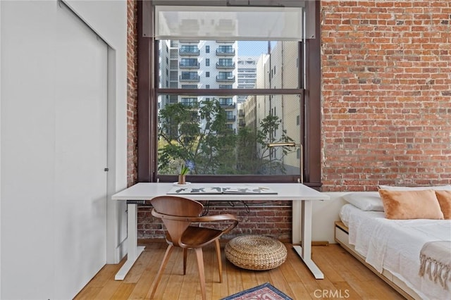 460 S Spring St Unit 302, Los Angeles, CA 90013 - interior space featuring hardwood / wood-style flooring, a healthy amount of sunlight, and brick wall