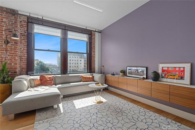 460 S Spring St Unit 302, Los Angeles, CA 90013 - living area with lofted ceiling and light wood-style flooring