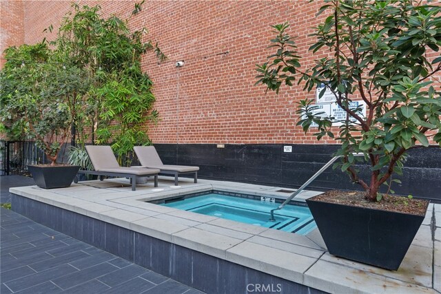 460 S Spring St Unit 302, Los Angeles, CA 90013 - view of swimming pool featuring a pool and a hot tub