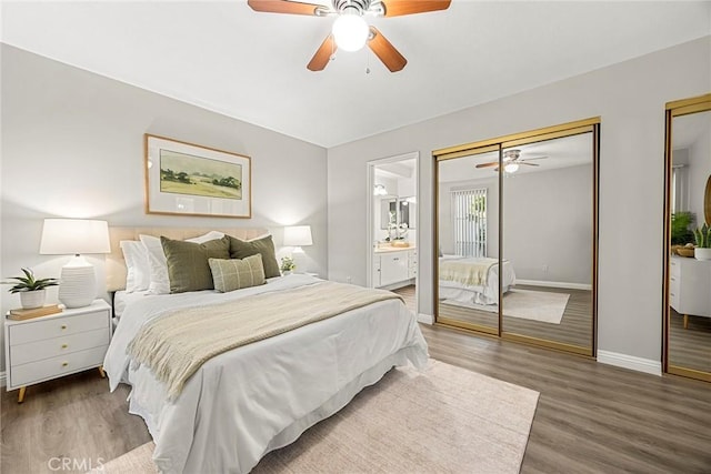 28 Brisbane Way, Irvine, CA 92612 - bedroom with two closets, wood finished floors, connected bathroom, and a ceiling fan