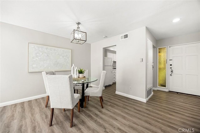 28 Brisbane Way, Irvine, CA 92612 - dining space featuring wood finished floors, a chandelier, and recessed lighting