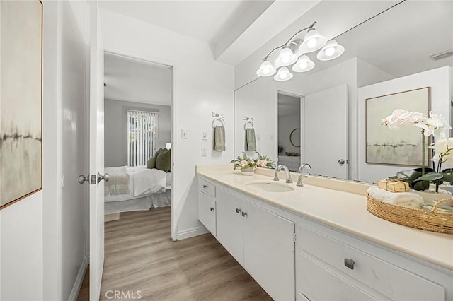 28 Brisbane Way, Irvine, CA 92612 - bathroom featuring connected bathroom, vanity, and wood finished floors