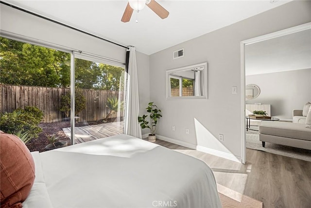 28 Brisbane Way, Irvine, CA 92612 - bedroom featuring multiple windows, wood finished floors, access to outside, and radiator heating unit