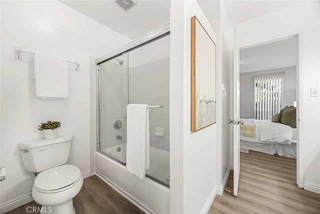 28 Brisbane Way, Irvine, CA 92612 - ensuite bathroom with wood finished floors and bath / shower combo with glass door