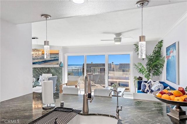 26056 Vista Dr E Unit 64, Dana Point, CA 92624 - dining area with ceiling fan and crown molding