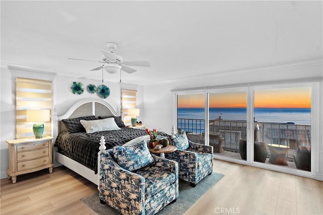 26056 Vista Dr E Unit 64, Dana Point, CA 92624 - bedroom featuring crown molding, access to outside, light wood-style floors, and a water view