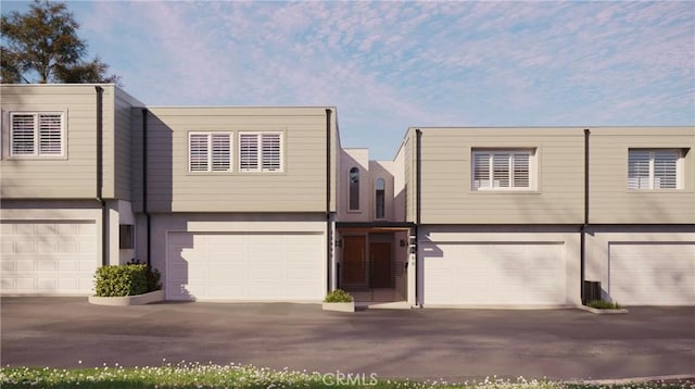 26056 Vista Dr E Unit 64, Dana Point, CA 92624 - view of property with stucco siding and a garage