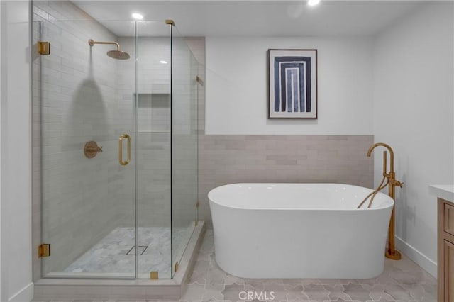3649 Mount Vernon Dr, View Park, CA 90008 - bathroom with a soaking tub, vanity, and a shower stall