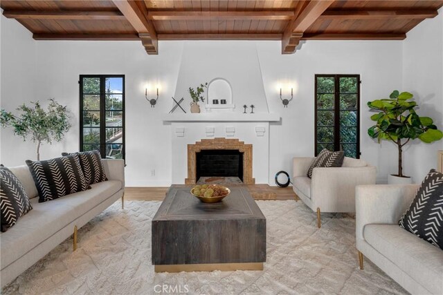 3649 Mount Vernon Dr, View Park, CA 90008 - living room with a wealth of natural light, light wood-type flooring, wooden ceiling, and a large fireplace