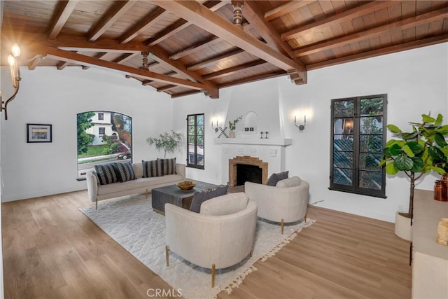 3649 Mount Vernon Dr, View Park, CA 90008 - living area featuring vaulted ceiling with beams, light wood-style floors, wood ceiling, and a brick fireplace