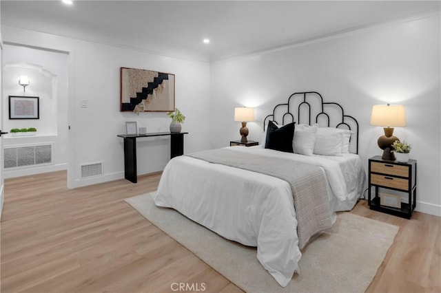 3649 Mount Vernon Dr, View Park, CA 90008 - bedroom with ornamental molding, baseboards, light wood-style floors, and visible vents