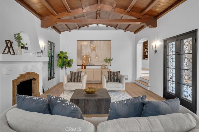 3649 Mount Vernon Dr, View Park, CA 90008 - living area featuring wood ceiling, arched walkways, vaulted ceiling with beams, and wood finished floors