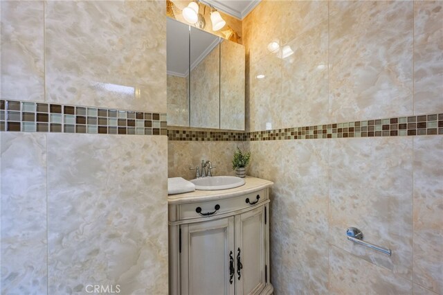 3569 Kelton Ave, Los Angeles, CA 90034 - bathroom with ornamental molding, vanity, and tile walls