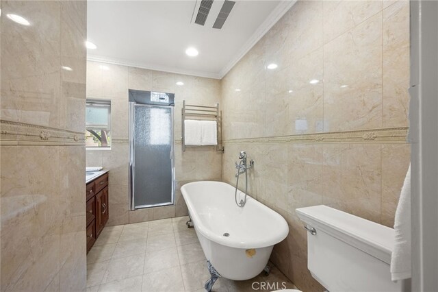 3569 Kelton Ave, Los Angeles, CA 90034 - bathroom featuring crown molding, tile walls, vanity, a freestanding tub, and a shower stall
