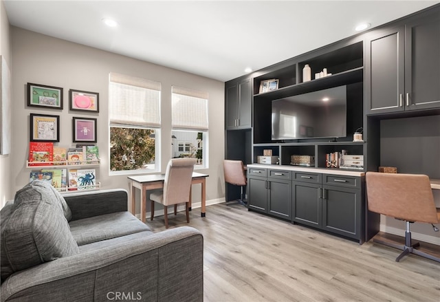 home office featuring light wood-style flooring, baseboards, and recessed lighting