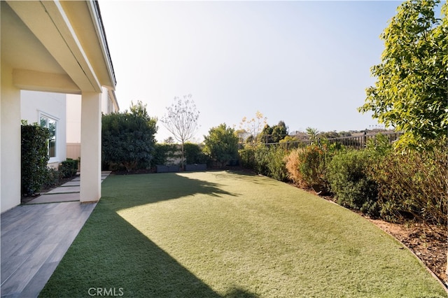 view of yard with a fenced backyard