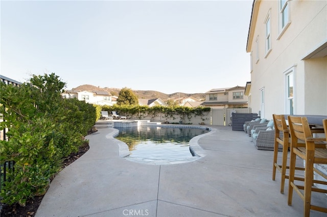 view of swimming pool featuring fence, a patio, and a fenced in pool