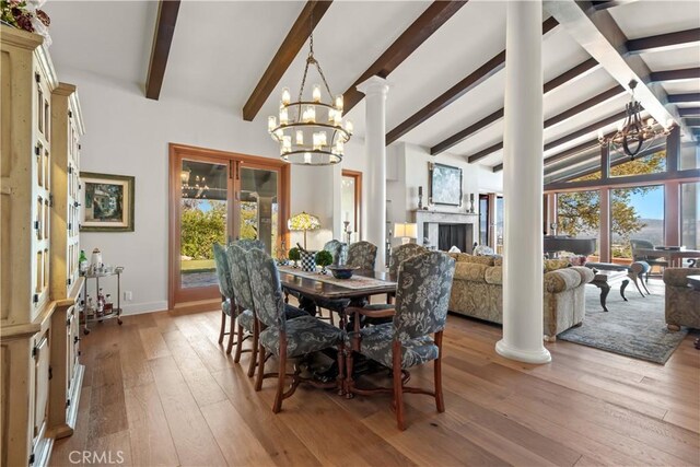 23815 Park Belmonte, Calabasas, CA 91302 - dining area with a chandelier, light wood-type flooring, baseboards, and decorative columns