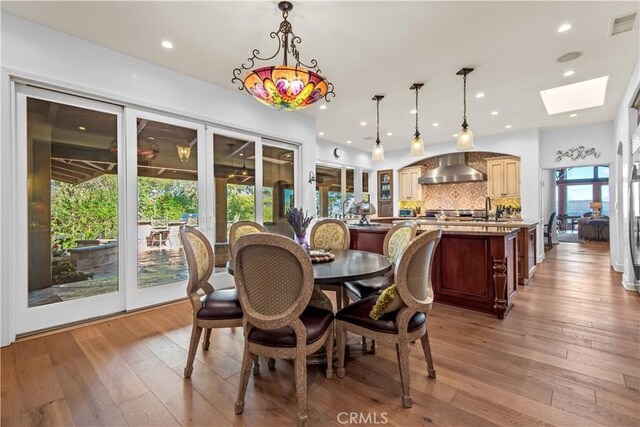23815 Park Belmonte, Calabasas, CA 91302 - dining room with a skylight, light wood-style floors, french doors, and recessed lighting