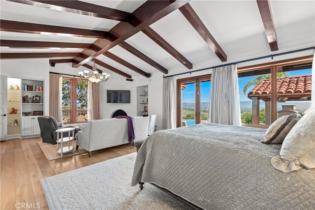 23815 Park Belmonte, Calabasas, CA 91302 - bedroom with multiple windows, a chandelier, light wood-type flooring, and french doors