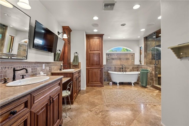 23815 Park Belmonte, Calabasas, CA 91302 - full bath featuring two vanities, a shower stall, a freestanding bath, tile walls, and recessed lighting