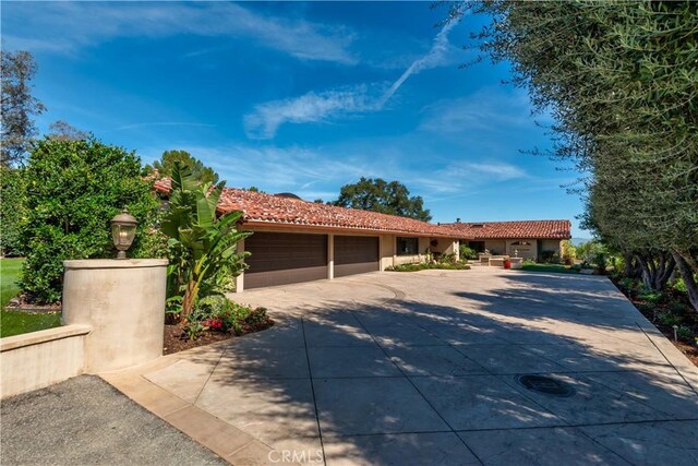 23815 Park Belmonte, Calabasas, CA 91302 - single story home featuring driveway, an attached garage, a tile roof, and stucco siding