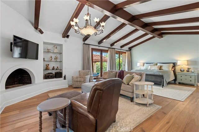 23815 Park Belmonte, Calabasas, CA 91302 - living room featuring a chandelier, light wood-style floors, and built in shelves