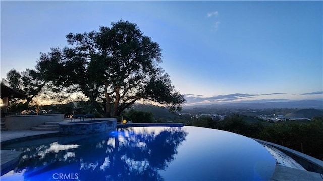 23815 Park Belmonte, Calabasas, CA 91302 - pool at dusk with a pool with connected hot tub