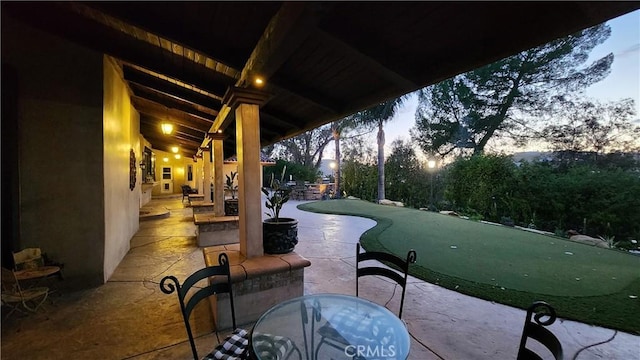23815 Park Belmonte, Calabasas, CA 91302 - view of patio / terrace with a putting area and outdoor dining area