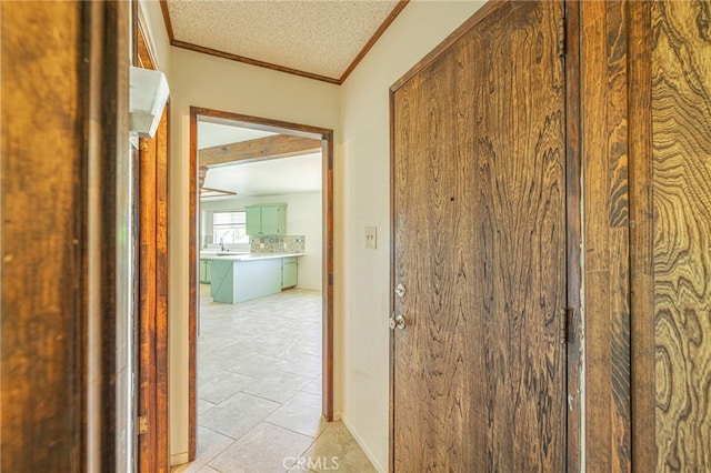 43421 45th St W, Lancaster, CA 93536 - hallway with crown molding, light tile patterned floors, and a textured ceiling