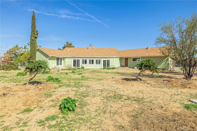 43421 45th St W, Lancaster, CA 93536 - back of house featuring a chimney and stucco siding