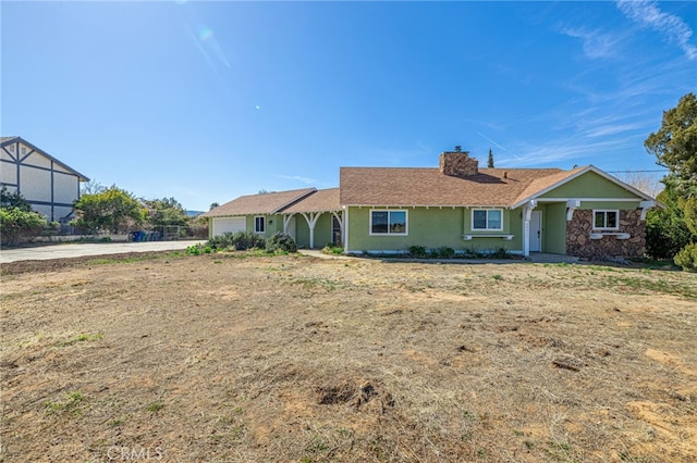 43421 45th St W, Lancaster, CA 93536 - single story home featuring an attached garage, a chimney, driveway, and stucco siding