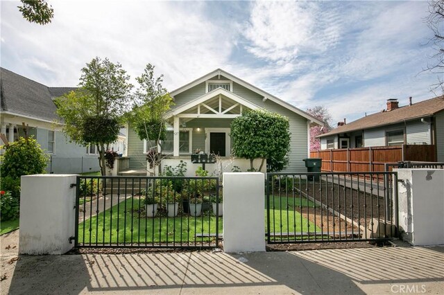 523 Lincoln Ave, Pasadena, CA 91103 - view of front of home featuring a gate, a fenced front yard, and a front lawn