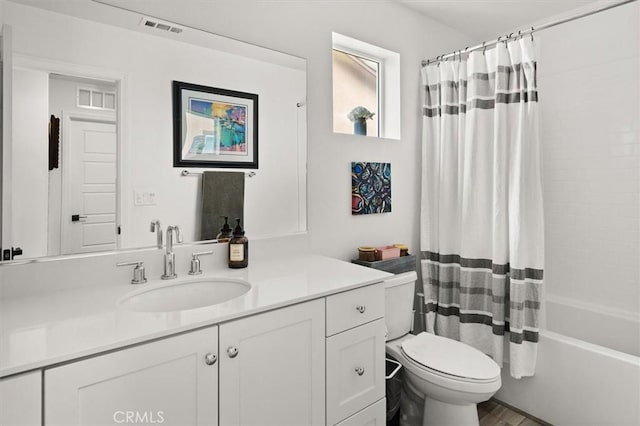 bathroom with toilet, vanity, shower / bath combo, and visible vents