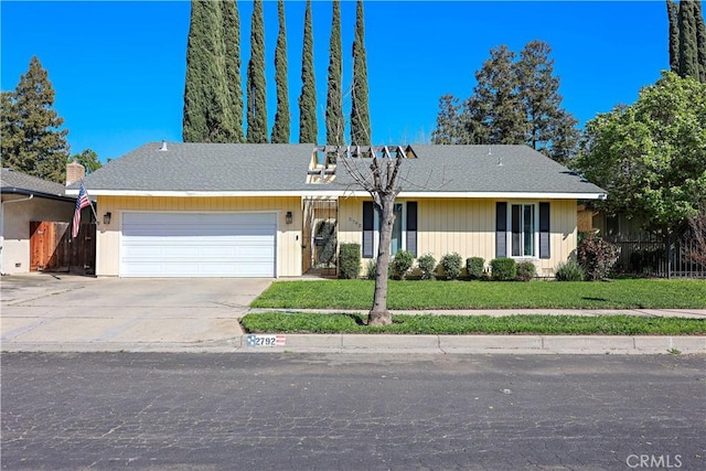 single story home featuring driveway, a garage, a front lawn, and fence