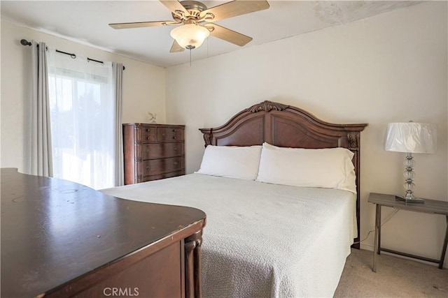 bedroom featuring light colored carpet and ceiling fan