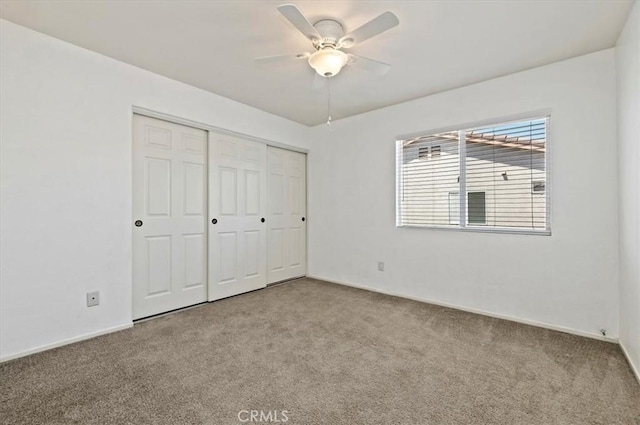 23403 Mountain Song, Murrieta, CA 92562 - unfurnished bedroom with a closet, baseboards, a ceiling fan, and carpet