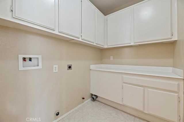 23403 Mountain Song, Murrieta, CA 92562 - washroom featuring hookup for an electric dryer, baseboards, hookup for a gas dryer, washer hookup, and cabinet space