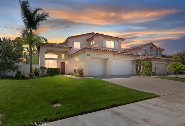 23403 Mountain Song, Murrieta, CA 92562 - mediterranean / spanish home featuring a front yard, a tiled roof, a garage, stucco siding, and driveway