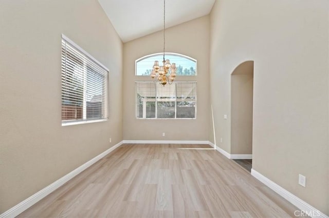 23403 Mountain Song, Murrieta, CA 92562 - unfurnished dining area featuring a chandelier, baseboards, and light wood-style flooring