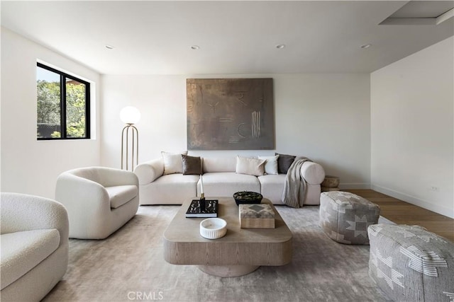 living area with wood finished floors, baseboards, and recessed lighting
