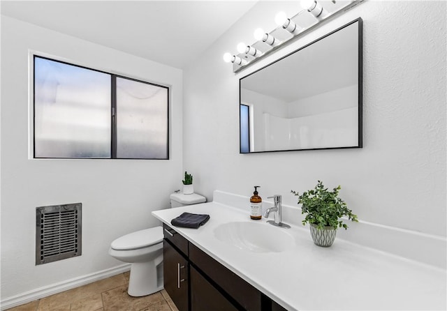 10022 Bismark Dr, Huntington Beach, CA 92646 - bathroom with toilet, vanity, baseboards, and visible vents