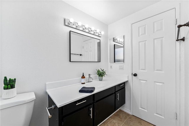 10022 Bismark Dr, Huntington Beach, CA 92646 - bathroom with toilet, tile patterned flooring, and vanity