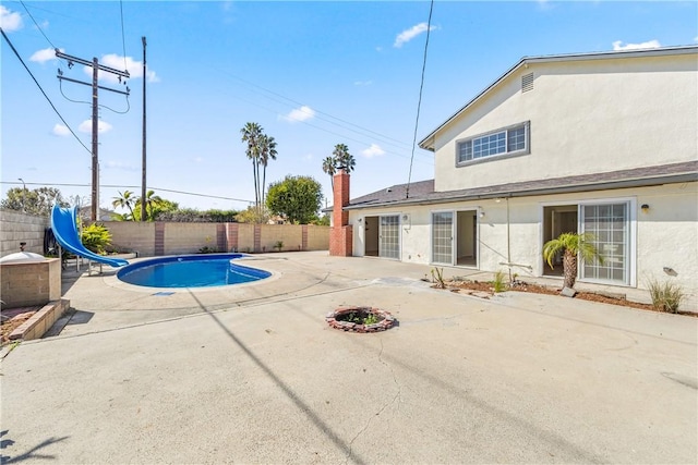 10022 Bismark Dr, Huntington Beach, CA 92646 - view of pool featuring a patio, a fenced in pool, a fenced backyard, and a water slide
