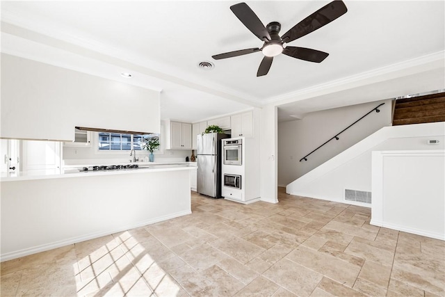10022 Bismark Dr, Huntington Beach, CA 92646 - kitchen featuring light countertops, stainless steel appliances, ceiling fan, and visible vents