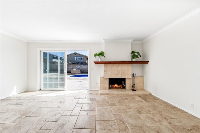 10022 Bismark Dr, Huntington Beach, CA 92646 - unfurnished living room featuring ornamental molding, baseboards, a fireplace, and stone finish floor