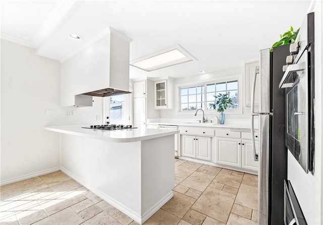 10022 Bismark Dr, Huntington Beach, CA 92646 - kitchen featuring island exhaust hood, a peninsula, dishwasher, stainless steel gas cooktop, and a sink