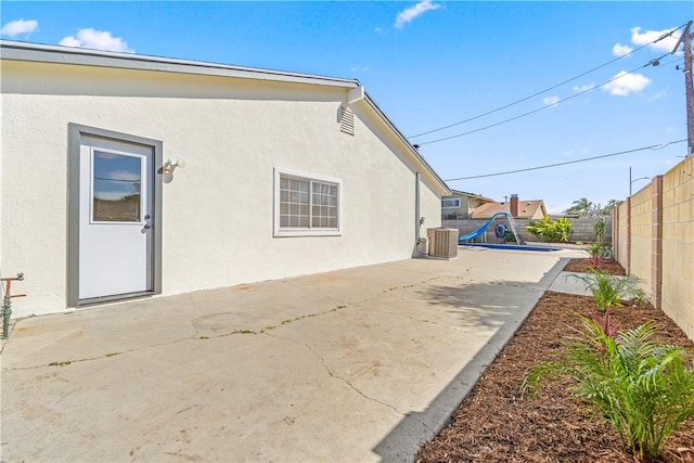 10022 Bismark Dr, Huntington Beach, CA 92646 - back of house featuring a fenced backyard, stucco siding, and a patio area
