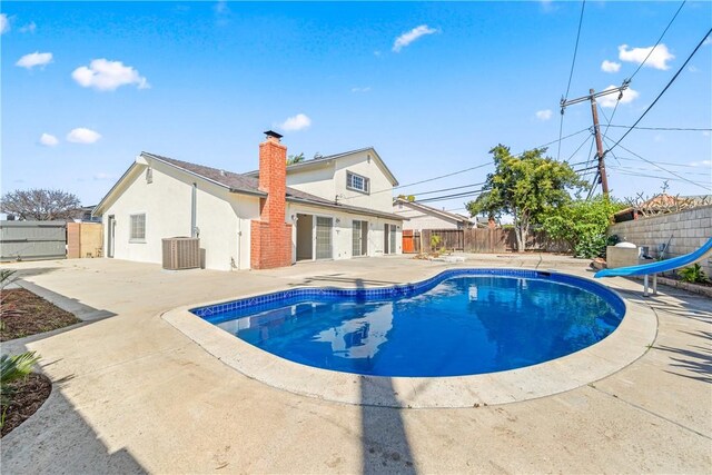 10022 Bismark Dr, Huntington Beach, CA 92646 - view of pool with a fenced backyard, a water slide, a patio area, and a fenced in pool
