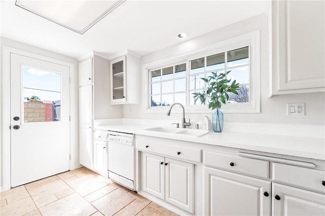 10022 Bismark Dr, Huntington Beach, CA 92646 - kitchen with white cabinets, light countertops, glass insert cabinets, a sink, and white dishwasher